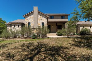 Exterior - Charming two-story vacation home with scenic golf course views. (Concan)