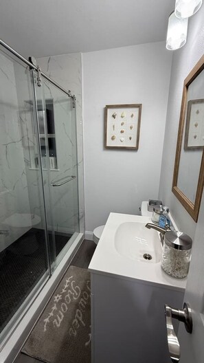 Shower, hair dryer, towels, soap