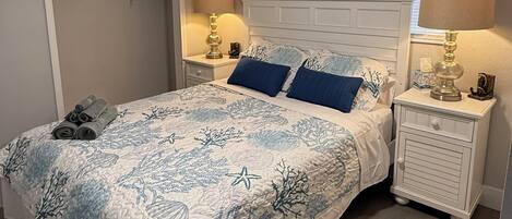 2 dormitorios, tabla de planchar con plancha, cuna de viaje