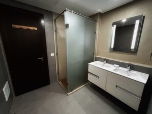 Shower, towels, soap, toilet paper