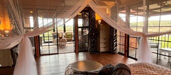 See the Big 5 from the viewing deck of this incredible riverside bush lodge!