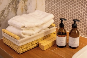 Shower, eco-friendly toiletries, hair dryer, towels