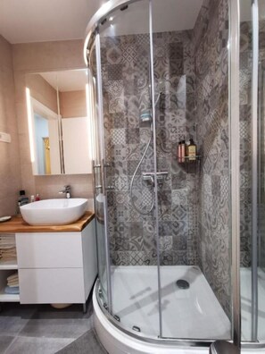Shower, hair dryer, towels, soap