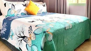 A bedroom with a bed, a headboard, curtains, a ceiling fan, and a window. - Charming 2-bedroom apartment with AC, WiFi in delightful Marrakech (Marrakech)
