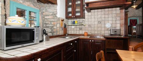Fridge, microwave, cookware/dishes/utensils, dining tables