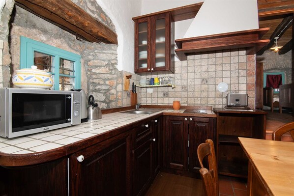 Fridge, microwave, cookware/dishes/utensils, dining tables