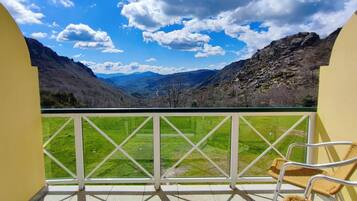 Enjoy breathtaking views of the surrounding mountains from this balcony.