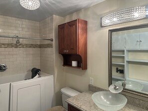 Jetted tub, hair dryer, towels, soap