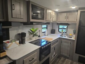 Fridge, microwave, coffee/tea maker, toaster