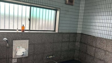 Separate bathtub and shower, slippers, towels