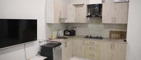 Fridge, microwave, coffee/tea maker, paper towels