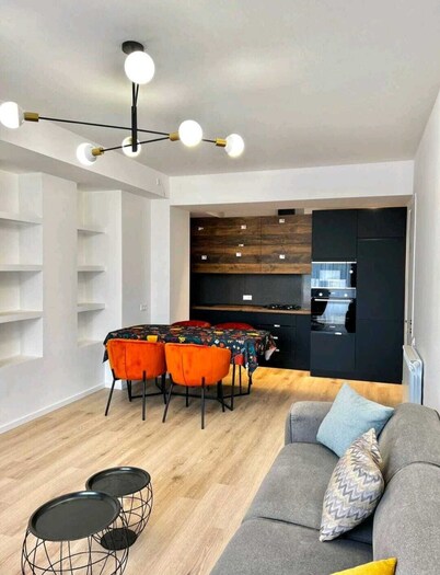 Central, modern apartment with balcony