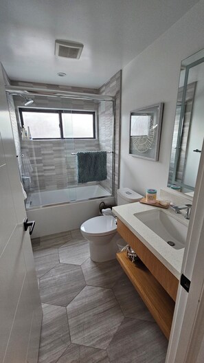 Shower, hair dryer, towels, soap