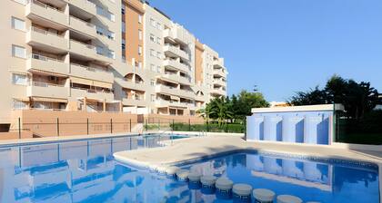 Apartment 'Jardines De Playa Gandia' with Shared Pool, Wi-Fi and Air Conditioning