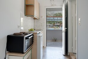 Fridge, coffee/tea maker, electric kettle, cookware/dishes/utensils