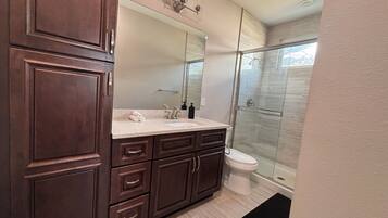 Shower, hair dryer, towels, soap