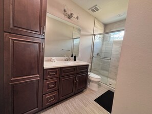 Shower, hair dryer, towels, soap