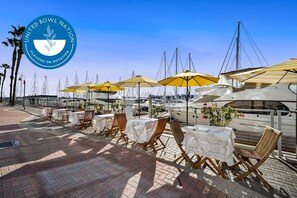 Outdoor dining - 1BR Penthouse Oasis, Stunning Marina Views! Walk to Beach (Marina del Rey)