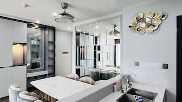 Standard Apartment, 3 Bedrooms | Private kitchen | Fridge, microwave, stovetop, rice cooker