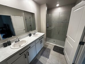 Shower, hair dryer, towels, toilet paper