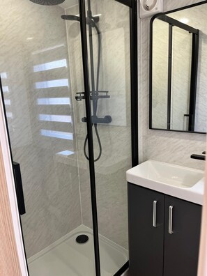 Shower, hair dryer, towels, soap