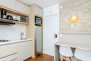 Fridge, microwave, stovetop, coffee/tea maker