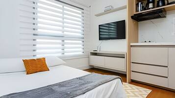 1 bedroom, desk, iron/ironing board, travel crib