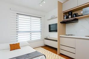 1 bedroom, desk, iron/ironing board, travel cot