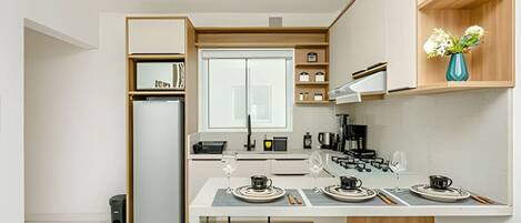 Fridge, microwave, stovetop, coffee/tea maker