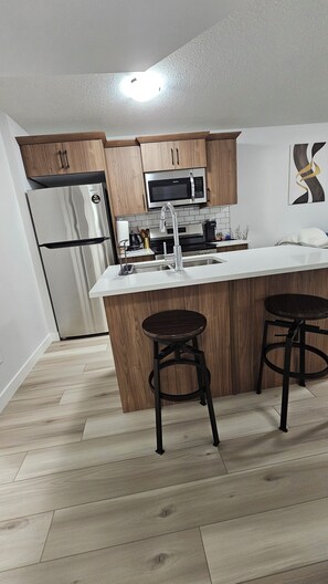 Fridge, microwave, oven, stovetop - Welcome to Heartland Suite-Your Modern Retreat in "The Greens"! (Regina)