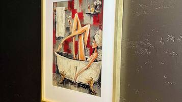 A framed artwork on a wall.