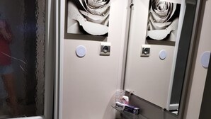 A bathroom with a window, a sink, a mirror, and a toilet. - Ideal rental campsite oasis village 5⭐️ (Puget-sur-Argens)