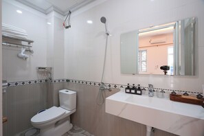 Shower, hair dryer, slippers, towels