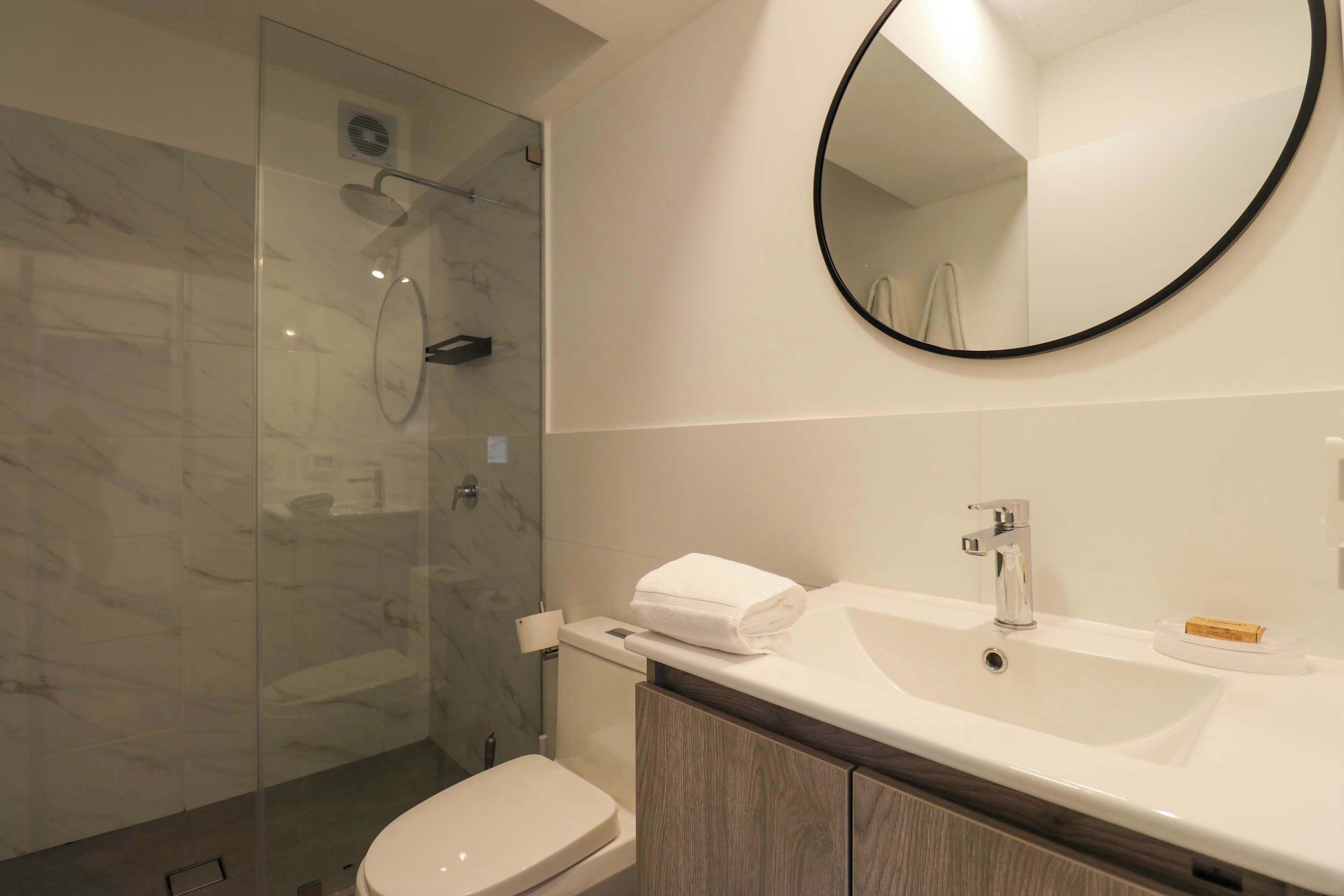 Shower, hair dryer, towels, shampoo