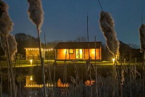 A modern house with a well-lit entrance and a small outdoor area. - Not Available for Rent (Whitchurch)