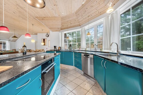 Family-friendly holiday home with pool and spa close to the North Sea.