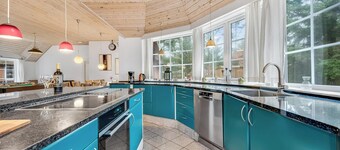 Family-friendly holiday home with pool and spa close to the North Sea.