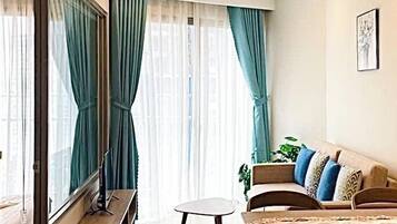 Luxury Apartment, Beach View, Beachside | Living area | 50-inch Smart TV with digital channels, smart speakers