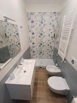 Hair dryer, bidet, towels, soap