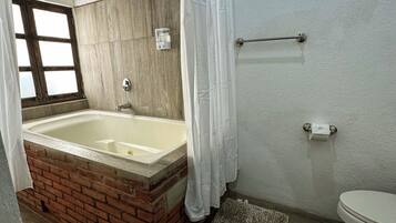 Shower, jetted tub, hair dryer, towels