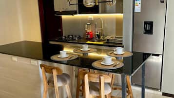 Fridge, microwave, stovetop, coffee/tea maker