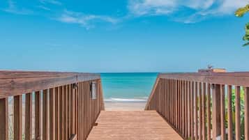 On the beach, sun loungers, beach towels, beach bar