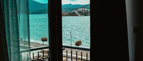 Deluxe Room, Partial Sea View | In-room safe, blackout curtains, free WiFi, bed sheets