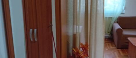 Studio (Apartments Petrova) | Living room | 32-inch flat-screen TV with cable channels