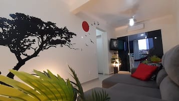 Standard Apartment | Living area | 32-inch TV with digital channels