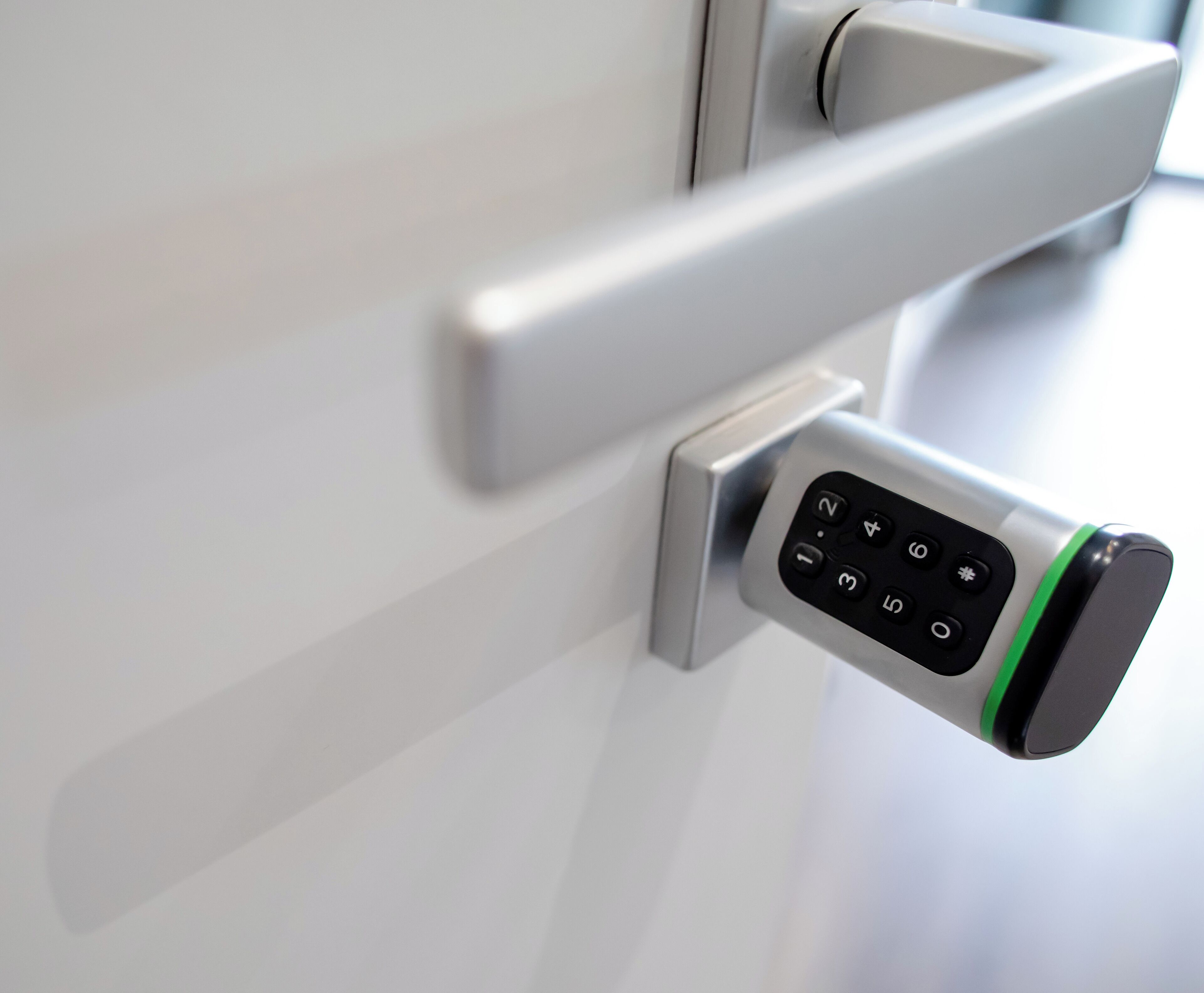 A modern door with a keypad lock.