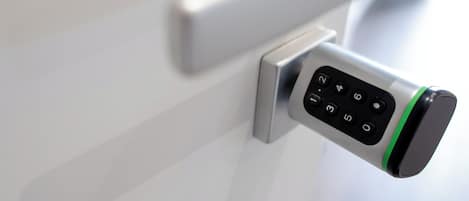 A modern door with a keypad lock.