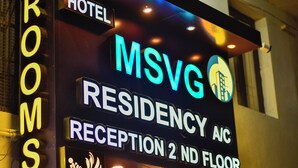 A hotel sign with "MSVG RESIDENCY A/C RECEPTION 2 ND FLOOR" indicating the location of the A/C reception on the second north floor.