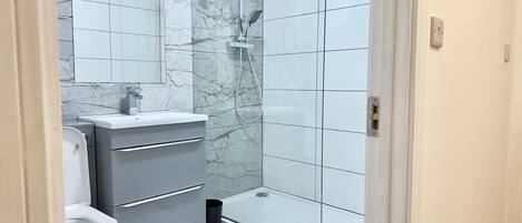 Shower, hair dryer, towels, soap