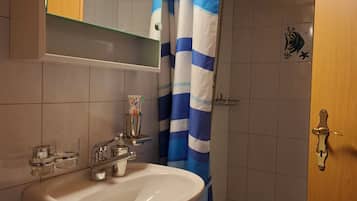 Shower, hair dryer, towels, toilet paper